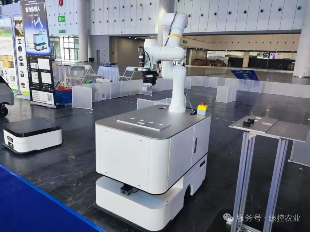 Autonomous mobile robot with integrated robotic arm displayed at GC Robotics booth WCIF 2025