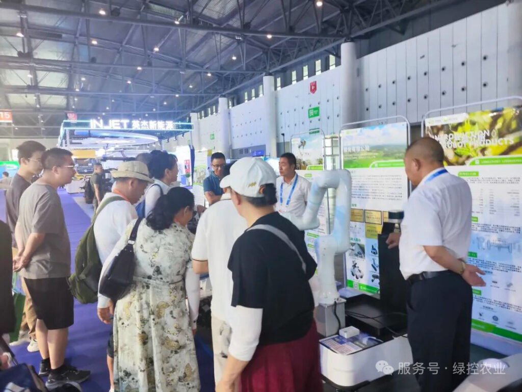 Crowd gathering around flagship harvesting robot chassis at GC Robotics booth WCIF 2025