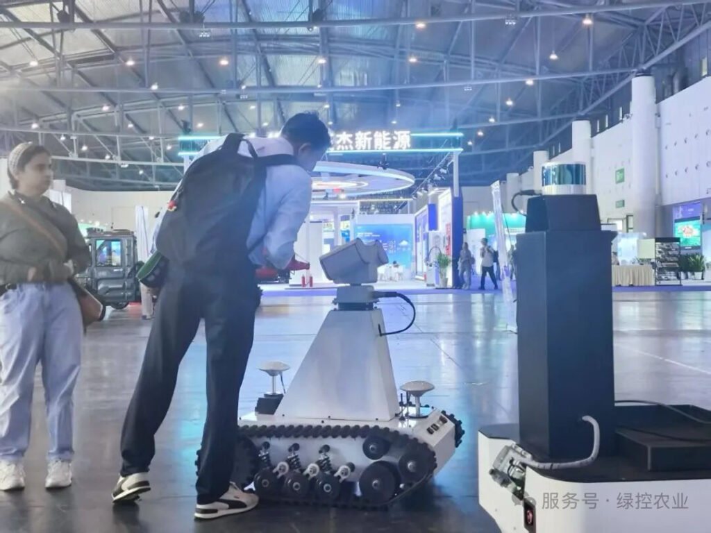 Visitors from different countries exploring GC Robotics (lvkong) mobile robot solutions at WCIF 2025