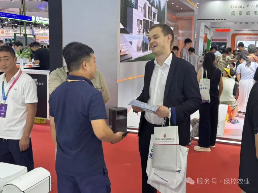 GC Robotics manager discussing mobile robot solutions with international European client at WRC 2025