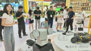 Visitors watching a GC Robotics robot platform demonstration