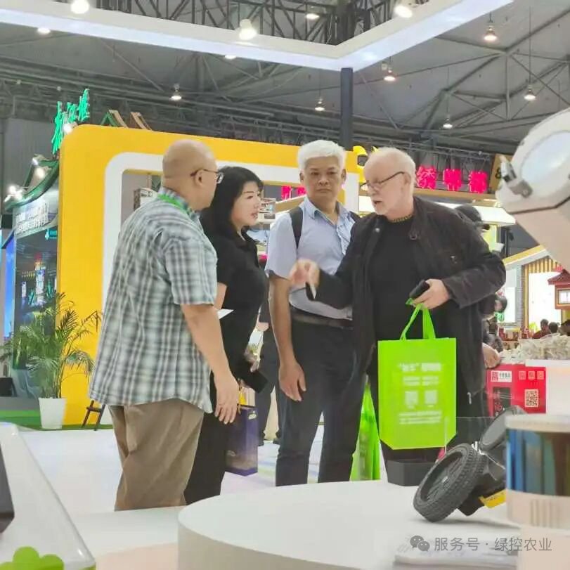 Visitors meeting with the GC Robotics team at an exhibition booth