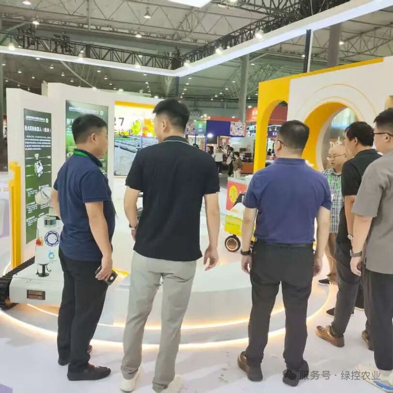 Visitors exploring GC Robotics mobile robot platforms at an exhibition