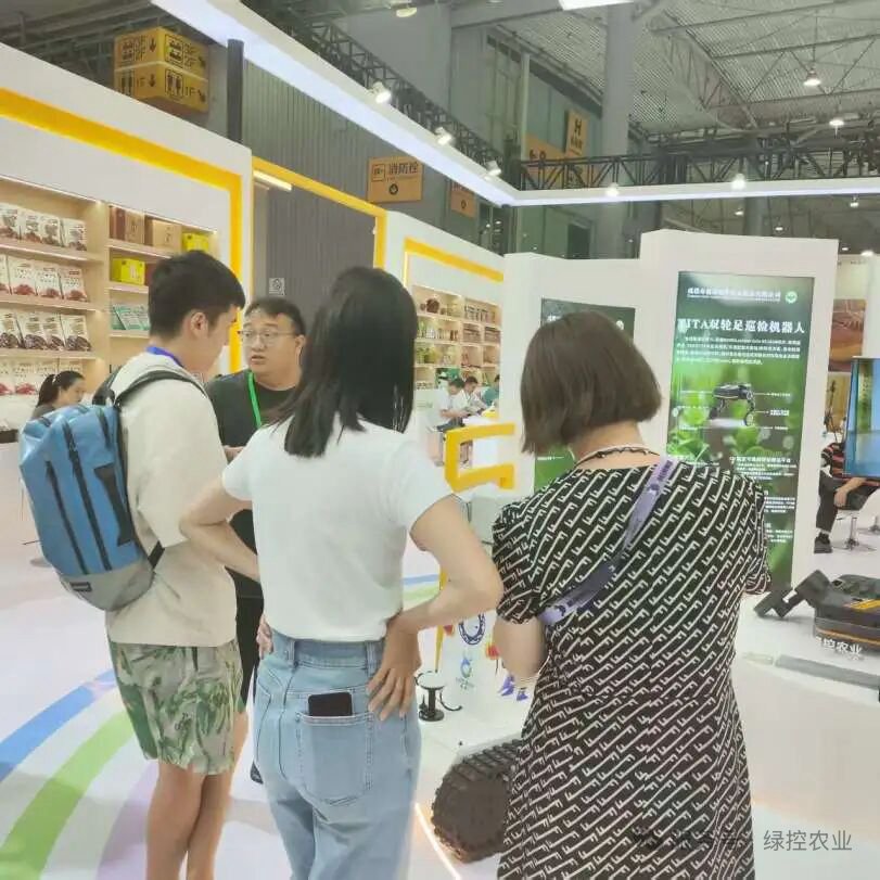 Visitors viewing GC Robotics robot platforms at an exhibition
