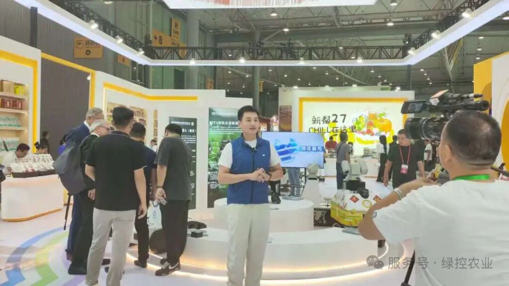 GC Robotics team demonstrating a mobile robot to exhibition visitors