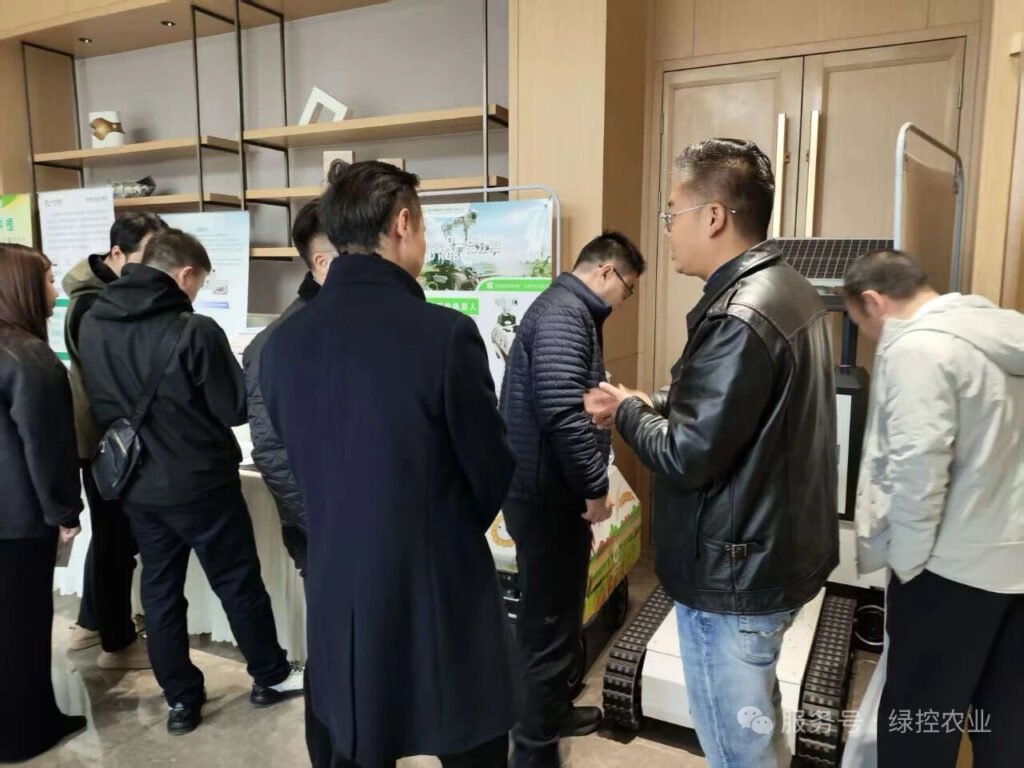 GC Robotics team member introducing agricultural robot platforms to exhibition visitors