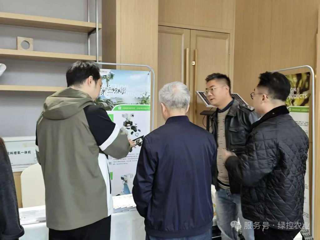 Industry visitors viewing GC Robotics agricultural inspection robots and display panels