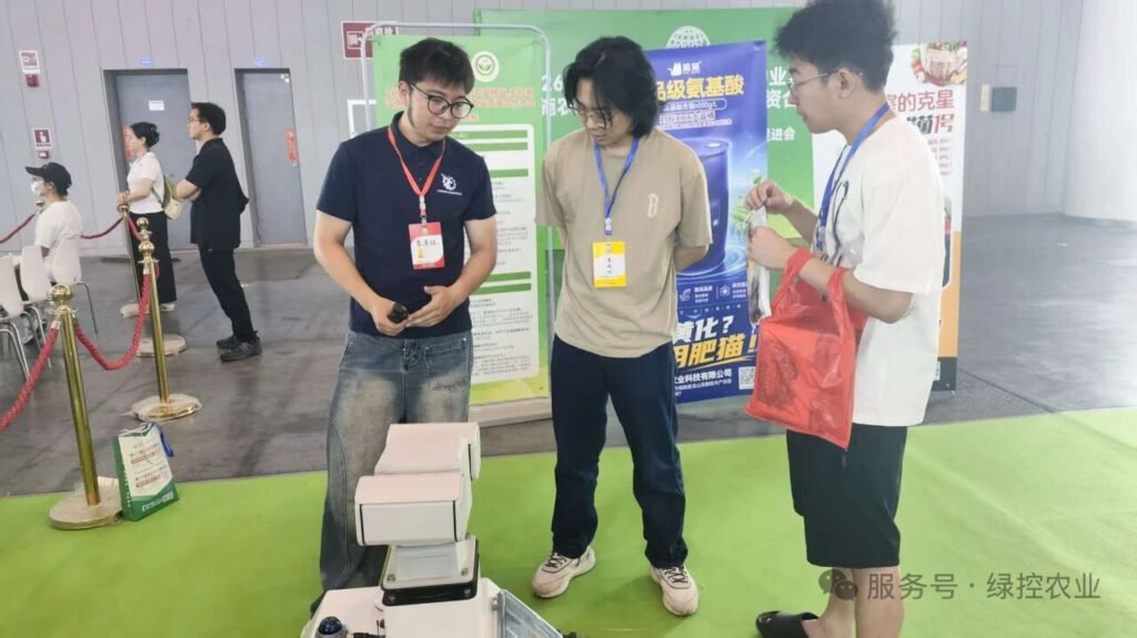 Visitors discuss robot platforms with GC Robotics at an exhibition in Chengdu