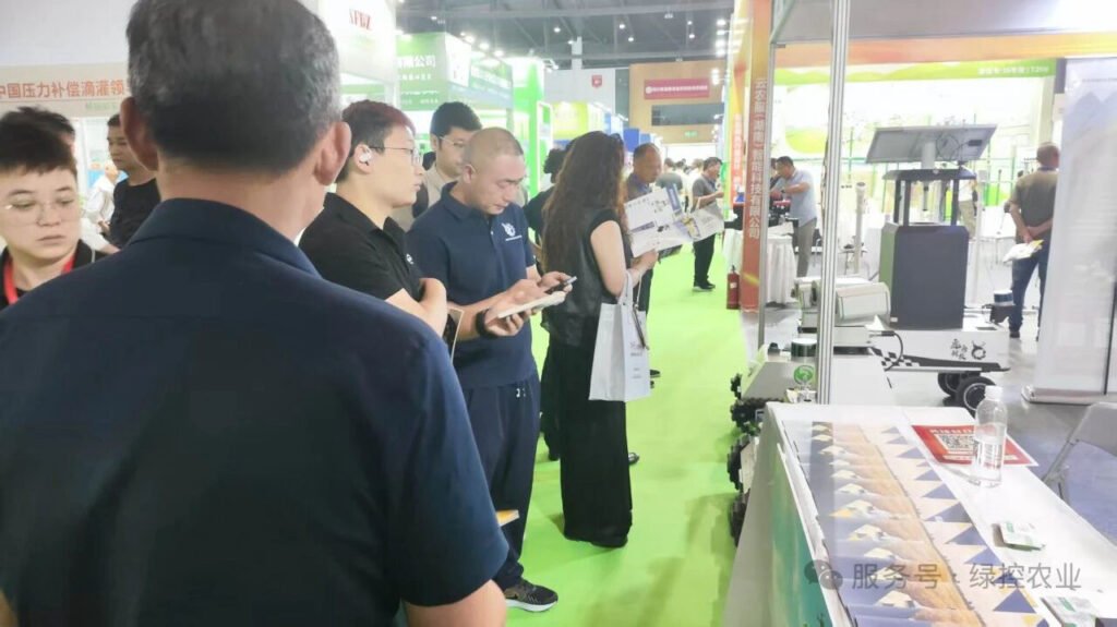 Visitors exploring GC Robotics mobile robot platforms at an agricultural exhibition
