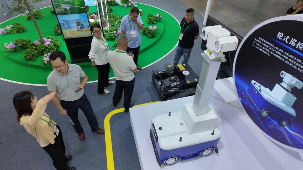 GC Robotics wheeled inspection robot displayed at an exhibition, designed for autonomous mobile inspection and industrial robotics applications.