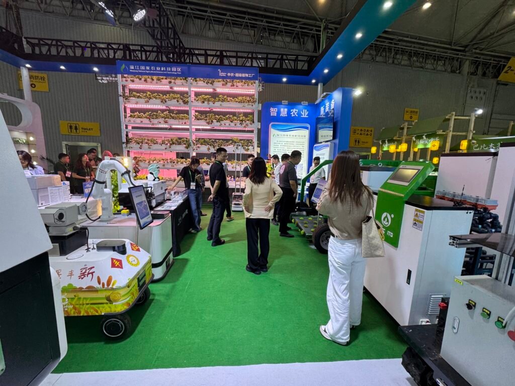 GC Robotics team demonstrating inspection robots with LiDAR and a PTZ camera to interested visitors at the Chengdu Expo.