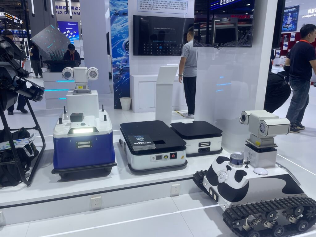 GC Robotics team introducing a ROS-based mobile robot chassis with LiDAR SLAM, depth camera, and open API/SDK to international buyers at CIIF 2026 in Shanghai.