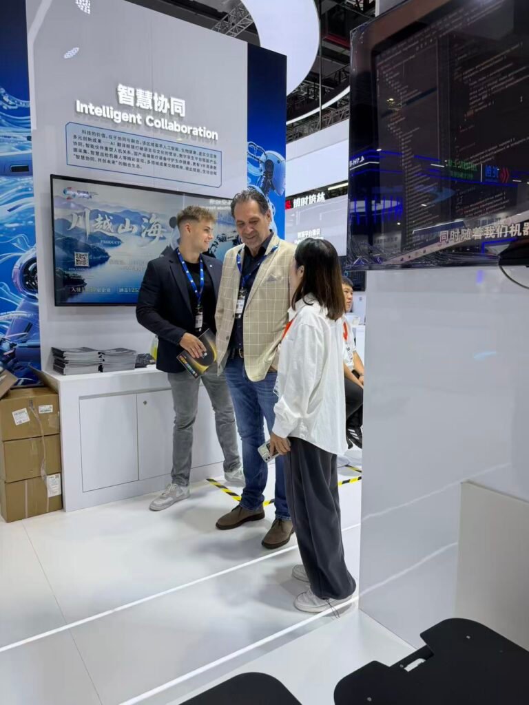GC Robotics team showcasing ROS-based mobile robot platforms and discussing secondary development and system integration with international buyers at CIIF 2026.