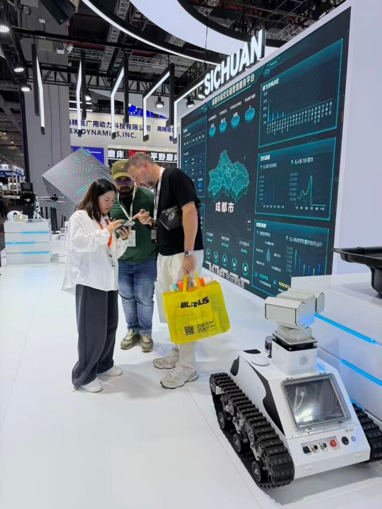 GC Robotics team introducing a ROS-based mobile robot chassis with LiDAR SLAM, depth camera, and open API/SDK to international buyers at CIIF 2026 in Shanghai.